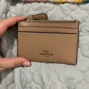 Brown/taupe keychain wallet .